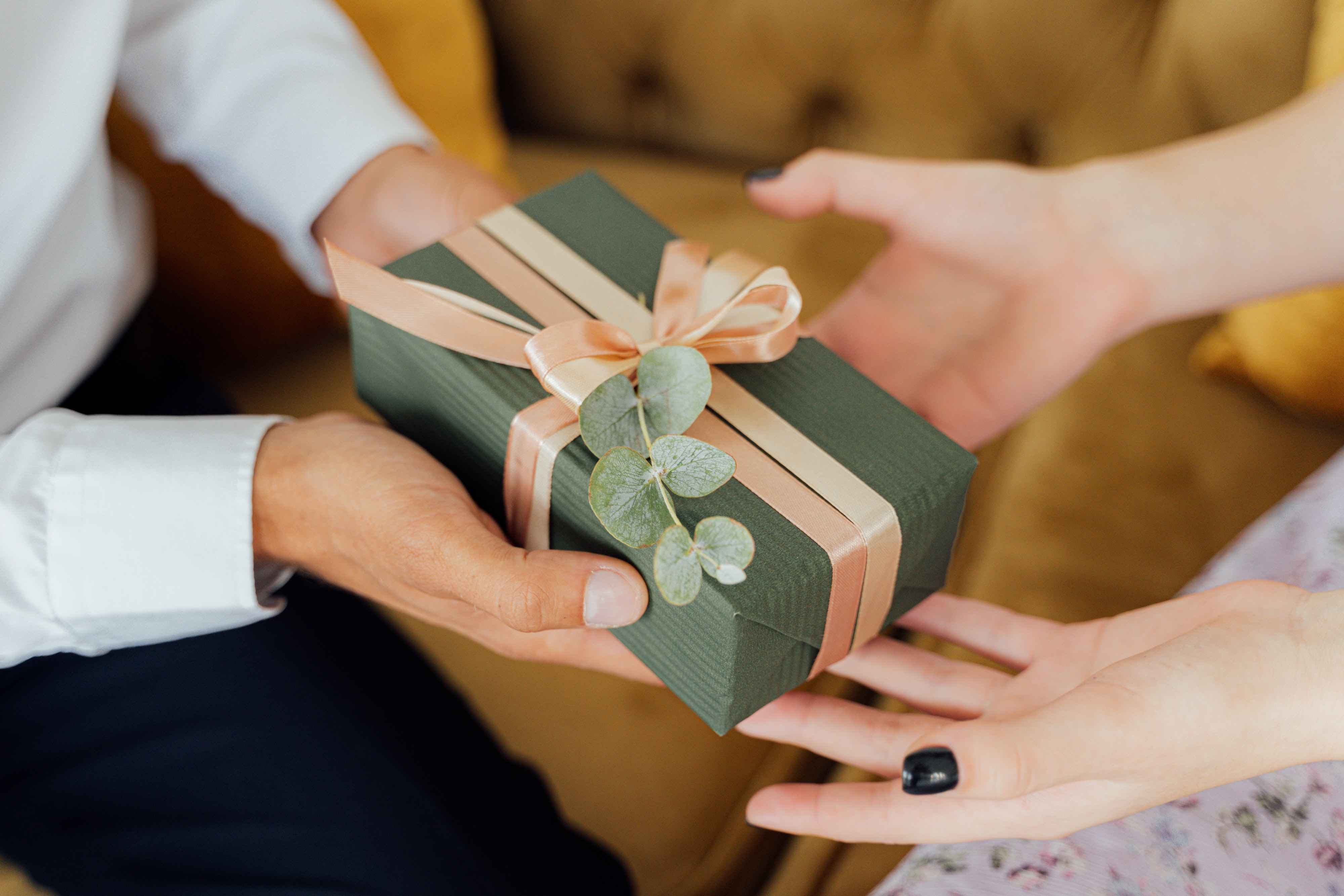 Giving a gift to a newborn as a token of joy for their birth